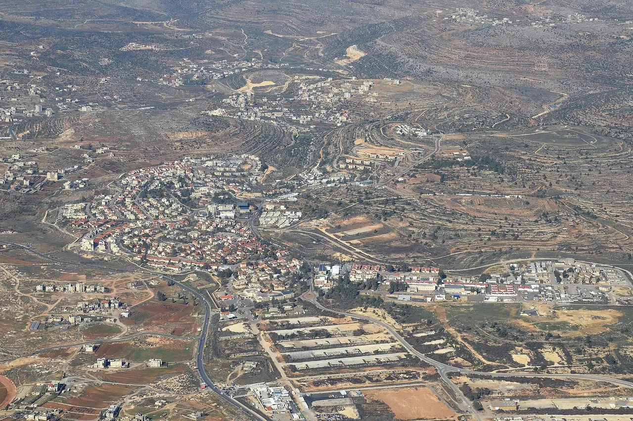 The front part of the picture is Beit El. Behind Beit El is Dura al-Qar' and behind it, with a housing project being built on the right, is Ein Siniya.