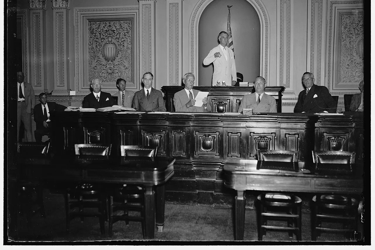 Title: Will run senate machine while Vice President Garner is absent. Washington, D.C. June 14. While Vice President Garner is vacationing in Texas during the next few weeks, Senator Key Pittman, President Pro Tem will preside over the Senate. Senator Pittman is shown with other officers of the Senate as the session opened this morning. Left to right: Chesley W. Jurney, Sergeant at Arms; Leslie L. Biffle, Secretary to the Majority; Charles L. Watkins, Parliamentarian and Journal Clerk; John C. Crockett, Cheif Clerk; Senator Key Pittman; Emery L. Frazier, Legislative Clerk; and Col. Edwin A. Halsey, Secretary. 6/14/37 Abstract/medium: 1 negative : glass ; 4 x 5 in. or smaller
